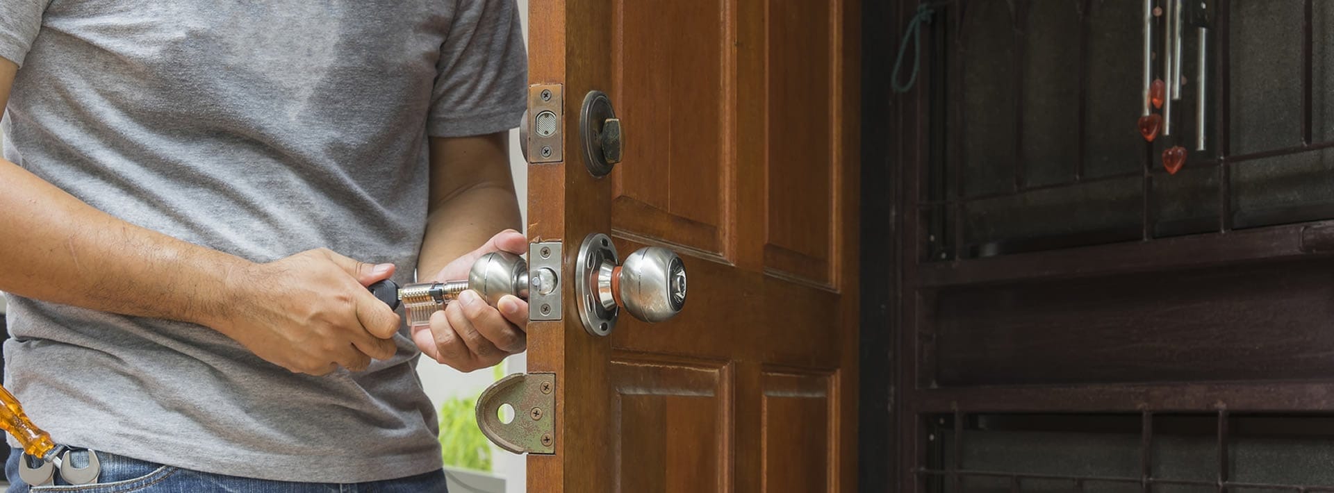 Residential locksmith installing a home door lock