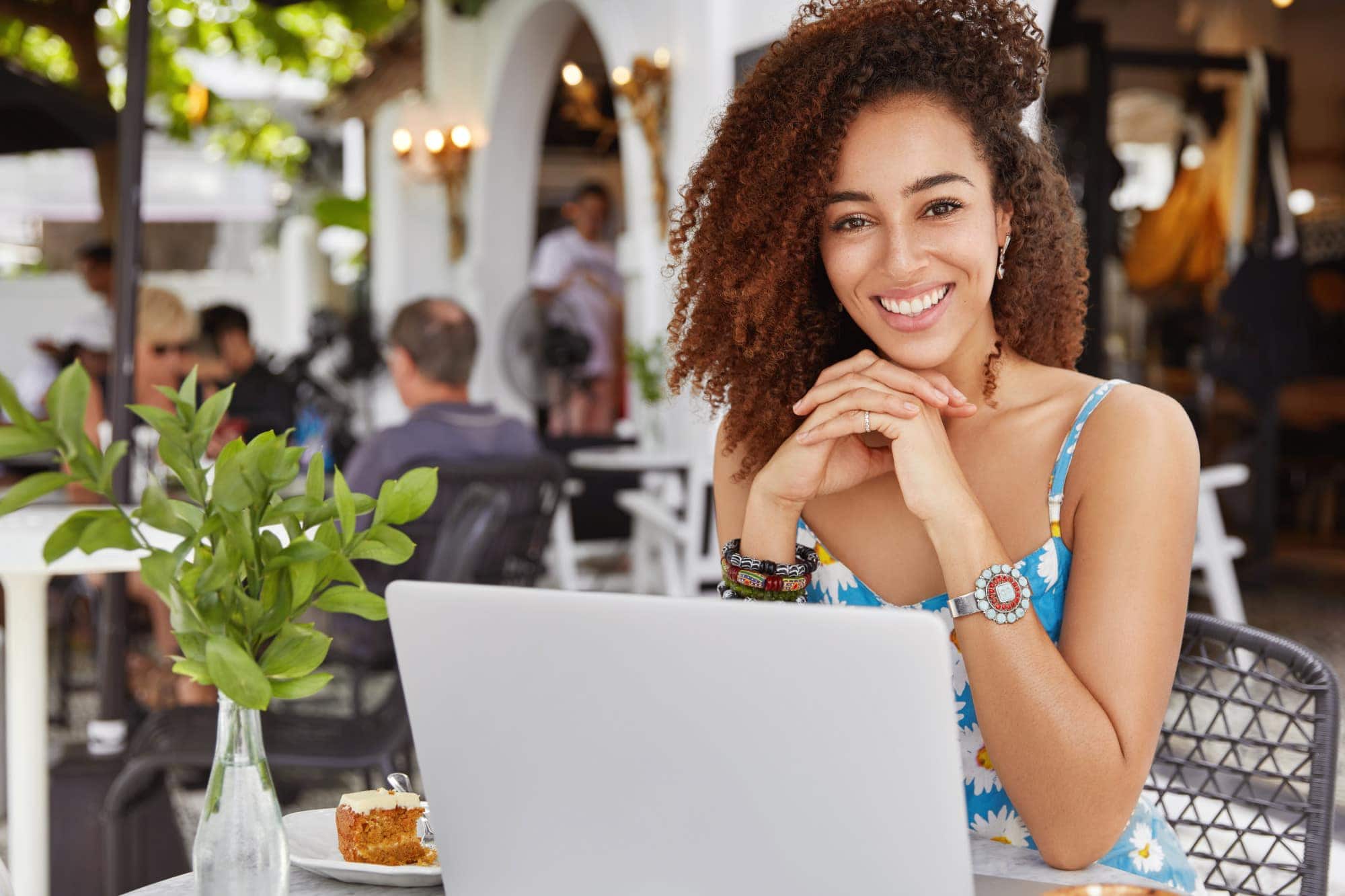 woman sitting at table giving testimonial